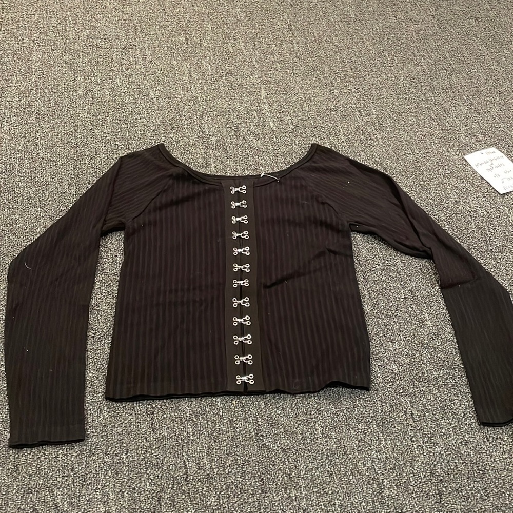 Brand new black ribbed long sleeve with silver clasps in middle.